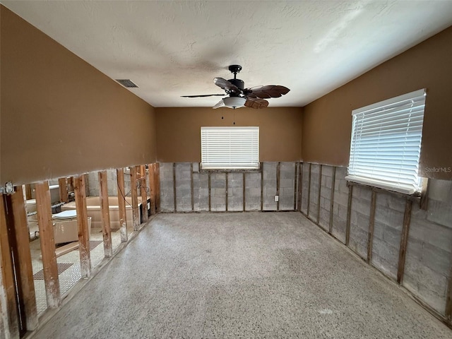 195 45th Ave, St Pete Beach, FL 33706 - spare room with ceiling fan and wainscoting