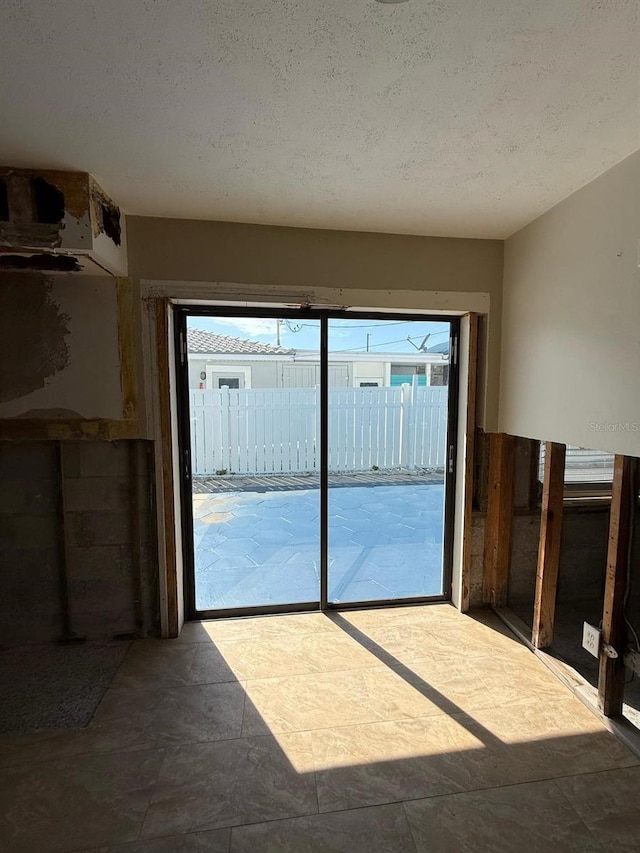 195 45th Ave, St Pete Beach, FL 33706 - spare room featuring a textured ceiling