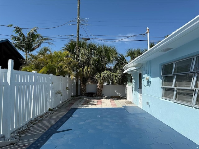 195 45th Ave, St Pete Beach, FL 33706 - fenced backyard featuring a patio