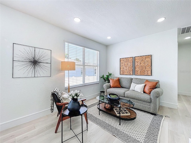 2711 W Cordelia St, Tampa, FL 33607 - living room featuring visible vents, recessed lighting, and a textured ceiling