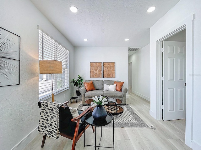 2711 W Cordelia St, Tampa, FL 33607 - living room featuring visible vents, baseboards, and light wood-type flooring