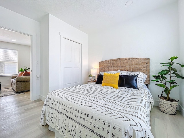 2711 W Cordelia St, Tampa, FL 33607 - bedroom featuring baseboards and light wood-style floors