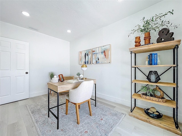 2711 W Cordelia St, Tampa, FL 33607 - home office featuring visible vents, baseboards, a textured ceiling, recessed lighting, and wood finished floors