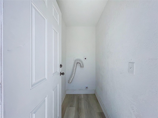2711 W Cordelia St, Tampa, FL 33607 - washroom with baseboards, electric dryer hookup, laundry area, and wood finished floors