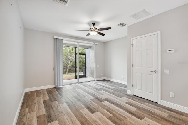 10407 Westpark Preserve Blvd, Tampa, FL 33625 - unfurnished room featuring light wood-style floors, a ceiling fan, and baseboards