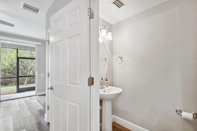 10407 Westpark Preserve Blvd, Tampa, FL 33625 - half bath featuring baseboards and wood finished floors