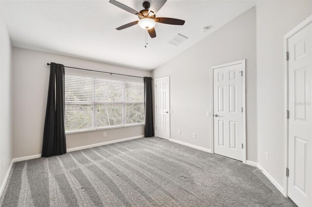 10407 Westpark Preserve Blvd, Tampa, FL 33625 - unfurnished bedroom with vaulted ceiling, carpet flooring, baseboards, a ceiling fan, and multiple closets