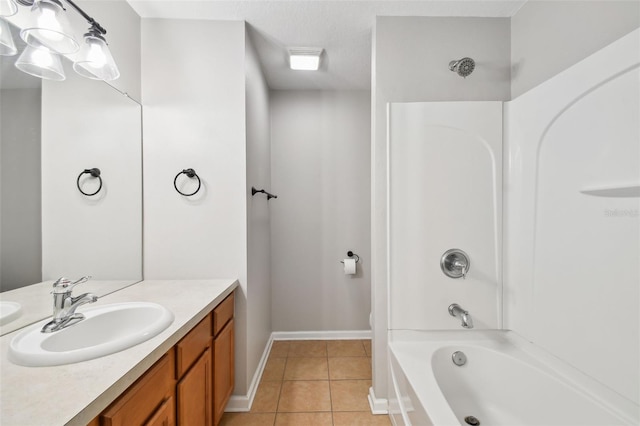10407 Westpark Preserve Blvd, Tampa, FL 33625 - full bath featuring tile patterned floors, shower / bath combination, vanity, and baseboards