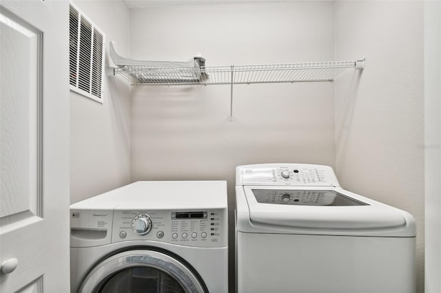 10407 Westpark Preserve Blvd, Tampa, FL 33625 - laundry area featuring separate washer and dryer