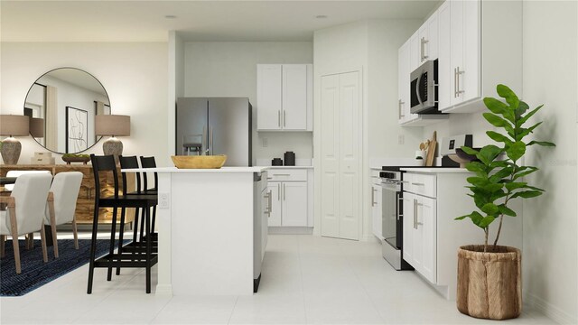 kitchen featuring white cabinetry, appliances with stainless steel finishes, and light tile patterned floors