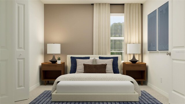 bedroom with baseboards and light colored carpet