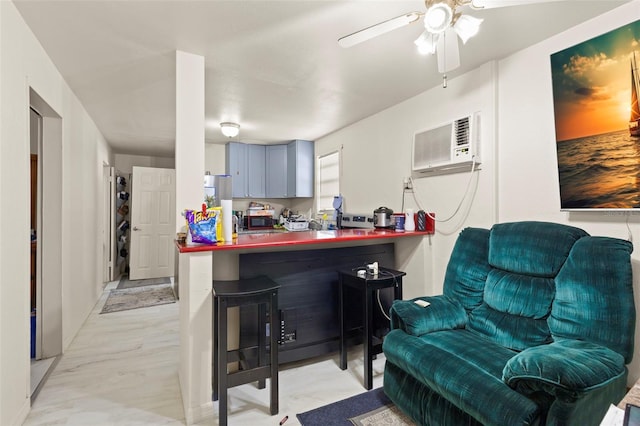 kitchen featuring a wall mounted AC, a breakfast bar, open floor plan, dark countertops, and ceiling fan