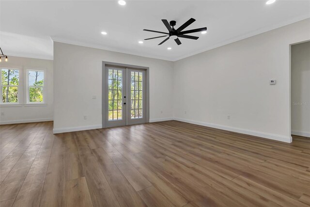 interior space with baseboards, a wealth of natural light, recessed lighting, and ornamental molding