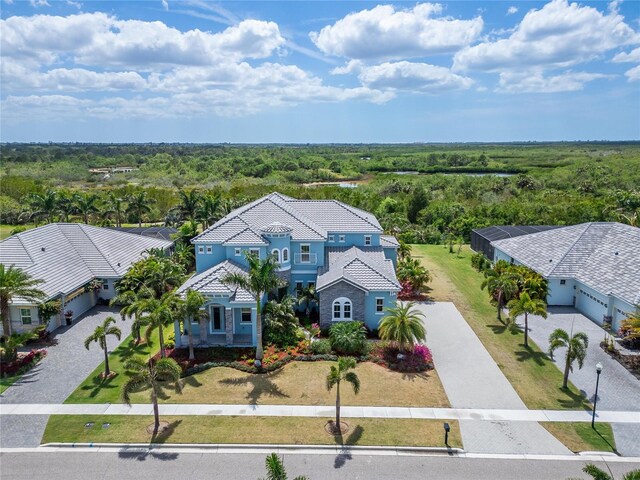 814 Manns Harbor Dr, Apollo Beach, FL 33572 - aerial view of property and surrounding area featuring a forest
