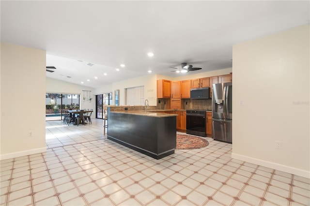 kitchen featuring ceiling fan, stainless steel fridge with ice dispenser, range, a peninsula, and light floors