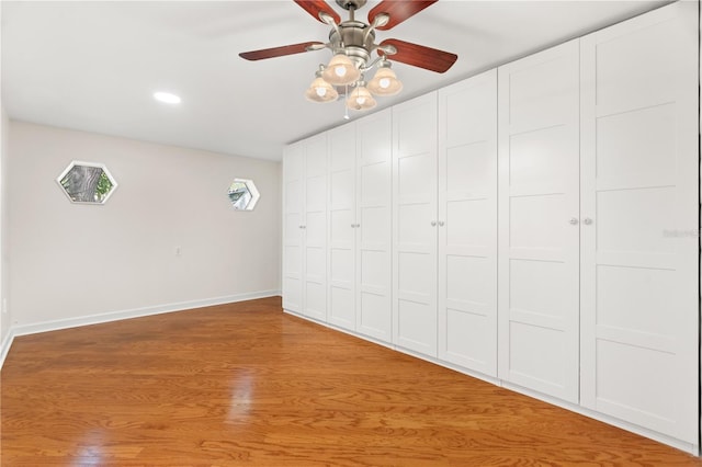 unfurnished bedroom with recessed lighting, baseboards, and a ceiling fan