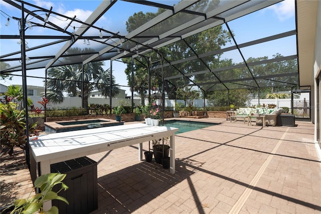 view of pool with glass enclosure, a fenced in pool, an outdoor hangout area, a patio, and a jacuzzi