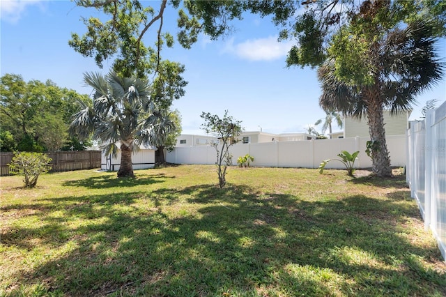 view of yard with a fenced backyard