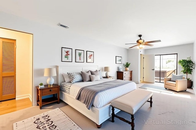 1509 Coachlight Way, Dunedin, FL 34698 - bedroom featuring carpet floors, baseboards, a ceiling fan, and access to exterior