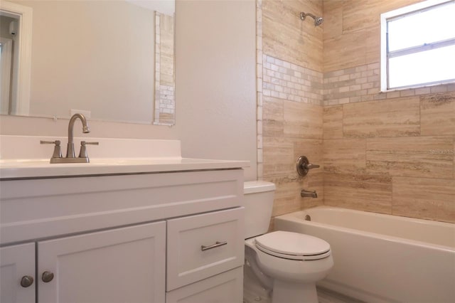 full bathroom featuring toilet, vanity, and tub / shower combination