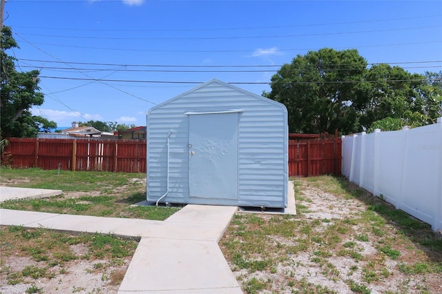 view of shed with a fenced backyard
