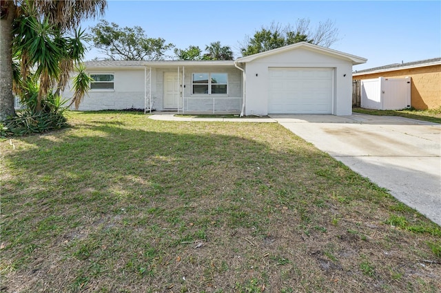 ranch-style house with fence, an attached garage, stucco siding, a front lawn, and driveway