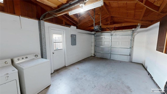 garage with washing machine and clothes dryer, a garage door opener, and electric panel