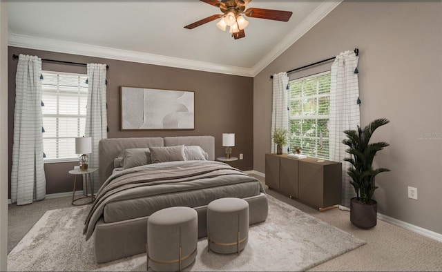 bedroom with lofted ceiling, crown molding, carpet floors, baseboards, and a ceiling fan