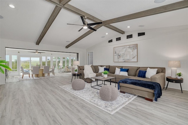 7906 Bayshore Dr, Seminole, FL 33776 - living area with wood finished floors, visible vents, a ceiling fan, and lofted ceiling with beams