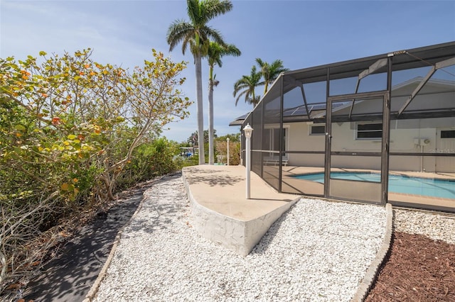 7906 Bayshore Dr, Seminole, FL 33776 - exterior space featuring an outdoor pool and glass enclosure
