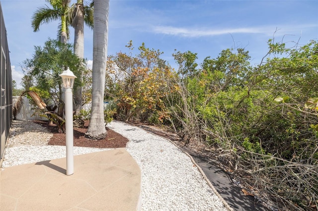 7906 Bayshore Dr, Seminole, FL 33776 - view of community featuring a patio area and fence