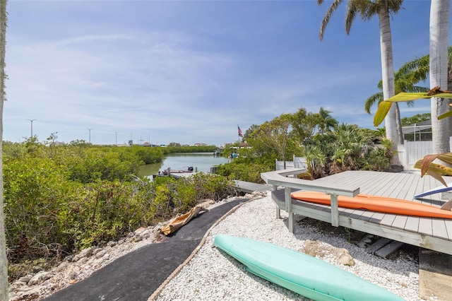 7906 Bayshore Dr, Seminole, FL 33776 - view of community with a deck with water view