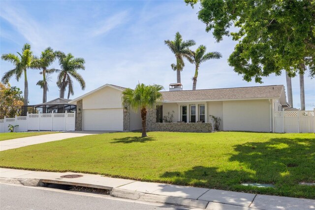 7906 Bayshore Dr, Seminole, FL 33776 - ranch-style house featuring a garage, stone siding, fence, and concrete driveway