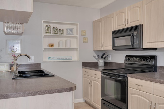 2605 Fulton St SW, Largo, FL 33774 - kitchen with black appliances, a sink, dark countertops, and light brown cabinetry