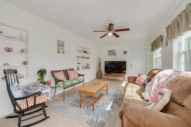 2605 Fulton St SW, Largo, FL 33774 - living area featuring built in features, ceiling fan, a wall unit AC, and light tile patterned floors