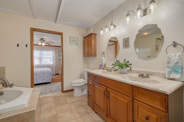 2605 Fulton St SW, Largo, FL 33774 - full bathroom featuring double vanity, a garden tub, toilet, tile patterned floors, and a ceiling fan