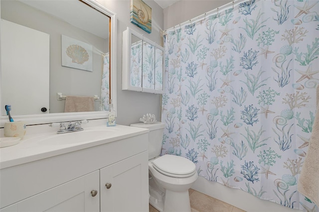 2605 Fulton St SW, Largo, FL 33774 - bathroom featuring vanity, toilet, and tile patterned flooring