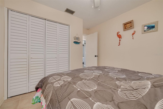 2605 Fulton St SW, Largo, FL 33774 - bedroom featuring tile patterned flooring, a closet, and ceiling fan