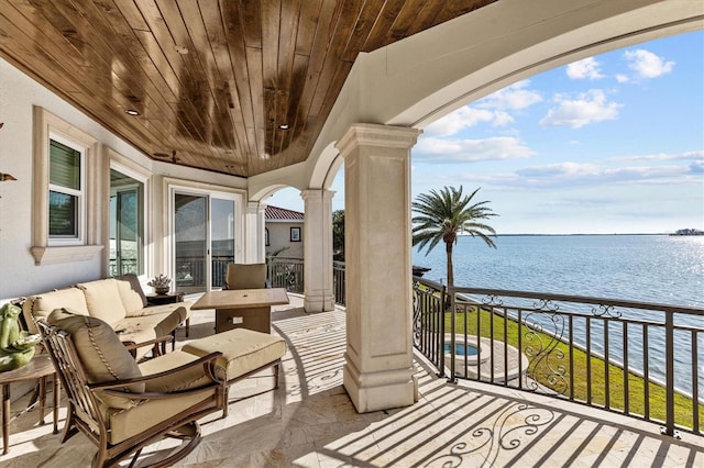balcony featuring a water view