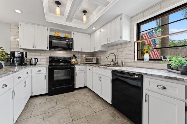 170 Ingrid Pl, Oldsmar, FL 34677 - kitchen with white cabinets, a sink, black appliances, and tasteful backsplash