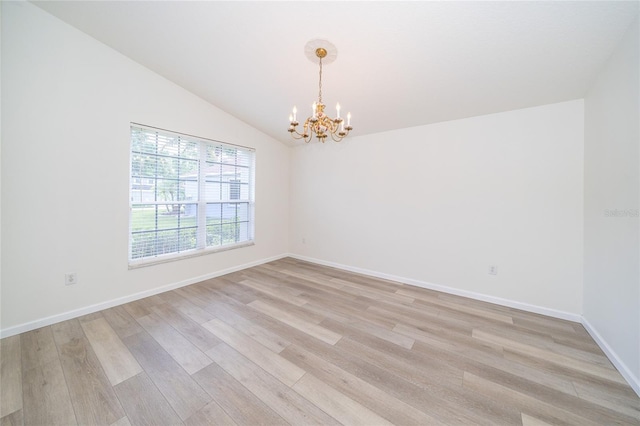 5331 Villagebrook Dr, Wesley Chapel, FL 33544 - empty room with a chandelier, light wood-style flooring, baseboards, and lofted ceiling