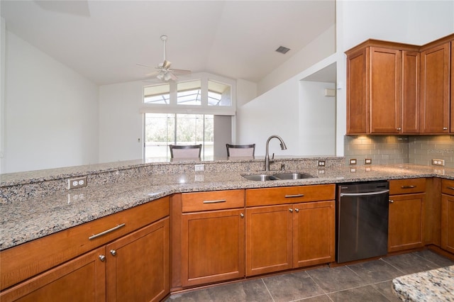 5331 Villagebrook Dr, Wesley Chapel, FL 33544 - kitchen with dishwashing machine, a sink, a ceiling fan, lofted ceiling, and brown cabinetry