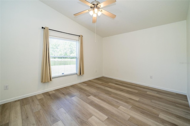 5331 Villagebrook Dr, Wesley Chapel, FL 33544 - spare room with lofted ceiling, light wood finished floors, a ceiling fan, and baseboards