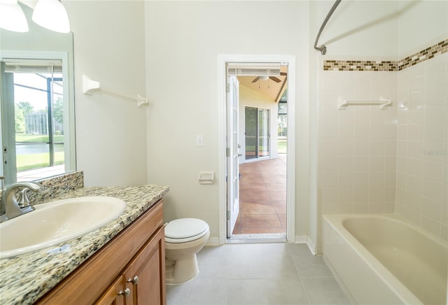 5331 Villagebrook Dr, Wesley Chapel, FL 33544 - bathroom with toilet, vanity, tile patterned floors, and bathing tub / shower combination
