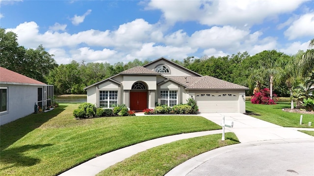 5331 Villagebrook Dr, Wesley Chapel, FL 33544 - mediterranean / spanish house featuring stucco siding, a garage, and a front lawn