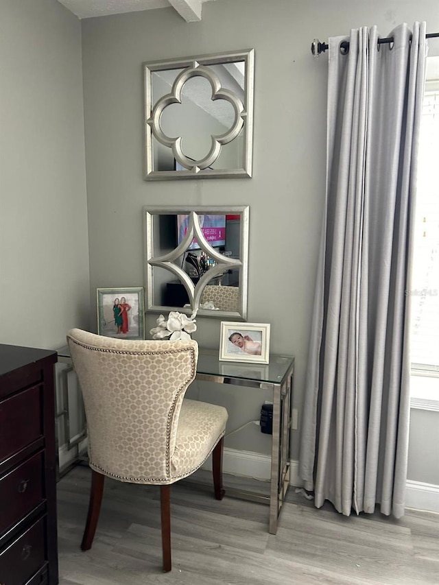office area with light wood-type flooring and baseboards