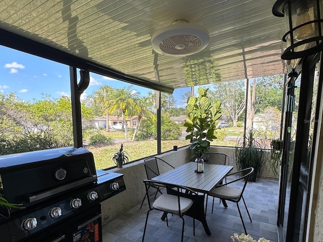 sunroom / solarium with outdoor dining space