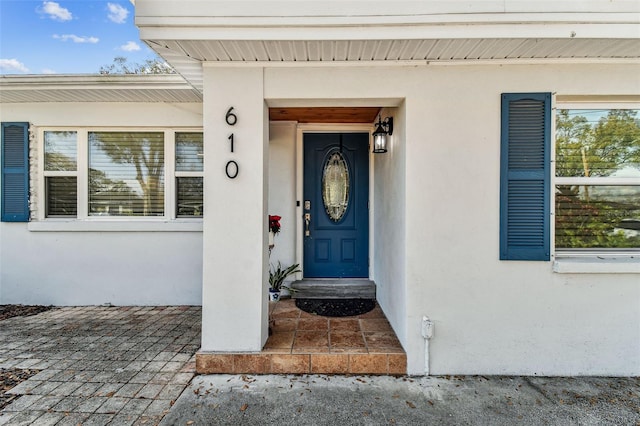 610 N Woodlynne Ave, Tampa, FL 33609 - view of exterior entry featuring stucco siding