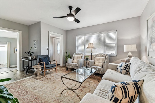 610 N Woodlynne Ave, Tampa, FL 33609 - living room with baseboards, ceiling fan, and wood finished floors