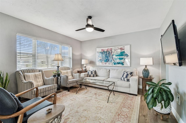 610 N Woodlynne Ave, Tampa, FL 33609 - living area with baseboards, wood finished floors, and a ceiling fan